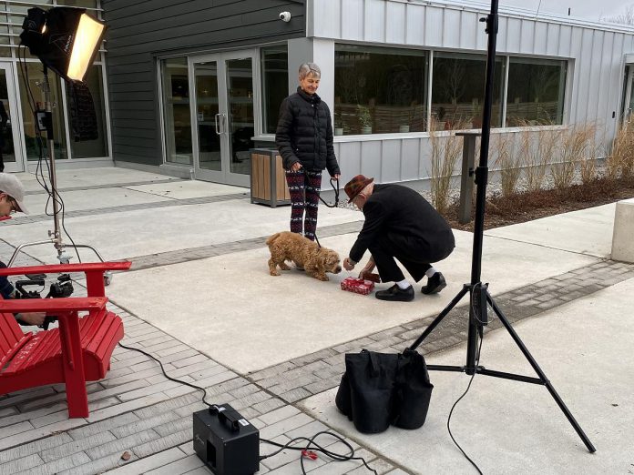 The ad for for the Peterborough Humane Society donated by Unmanned was partly filmed outside the Peterborough Animal Care Centre. The elderly man was played by the grandfather of Unmanned's co-founder and CMO Kyle Christie, the woman was played by a dedicated Peterborough Humane Society volunteer named Edith, and Lucy was played by a one-year-old cocker spaniel mix named Benji, who was adopted in real life just days after filming was completed. (Photo courtesy of Peterborough Humane Society)