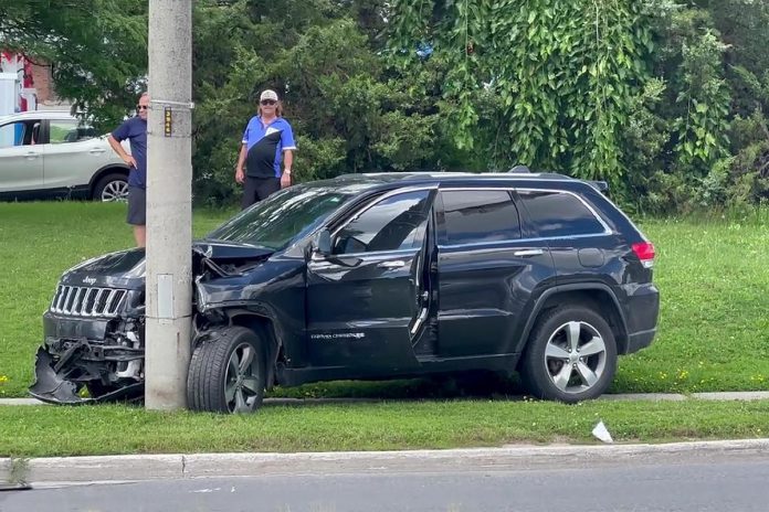 On August 11, 2023, a 28-year-old man driving a Jeep Cherokee fled police before crashing the vehicle into a pole at Chemong Road and Towerhill Road, exiting the vehicle while carrying a gun, and entering the Peterborough Volkswagen dealership where he assaulted an employee and held them hostage when police arrived. The man, later determined to be suffering from acute mental illness, began drinking automotive fluids after police tried to get him to drop his gun and later died. (kawarthaNOW screenshot of video by Barry Killen)