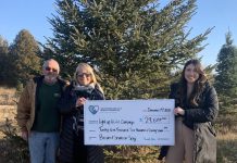 Sharron Wharram-Spry and Brian Spry of Spry Family Christmas Tree Farm in Cobourg present a cheque for $29,677 to Megan Fluxgold of the Northumberland Hills Hospital Foundation, representing the proceeds from the ninth annual Family Christmas at Spry Christmas Tree Farm fundraiser held on December 2, 2023. (Photo courtesy of Northumberland Hills Hospital Foundation)