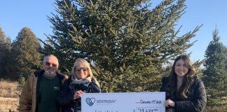 Sharron Wharram-Spry and Brian Spry of Spry Family Christmas Tree Farm in Cobourg present a cheque for $29,677 to Megan Fluxgold of the Northumberland Hills Hospital Foundation, representing the proceeds from the ninth annual Family Christmas at Spry Christmas Tree Farm fundraiser held on December 2, 2023. (Photo courtesy of Northumberland Hills Hospital Foundation)