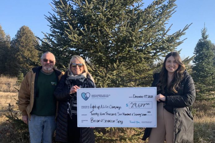 Sharron Wharram-Spry and Brian Spry of Spry Family Christmas Tree Farm in Cobourg present a cheque for $29,677 to Megan Fluxgold of the Northumberland Hills Hospital Foundation, representing the proceeds from the ninth annual Family Christmas at Spry Christmas Tree Farm fundraiser held on December 2, 2023. (Photo courtesy of Northumberland Hills Hospital Foundation)