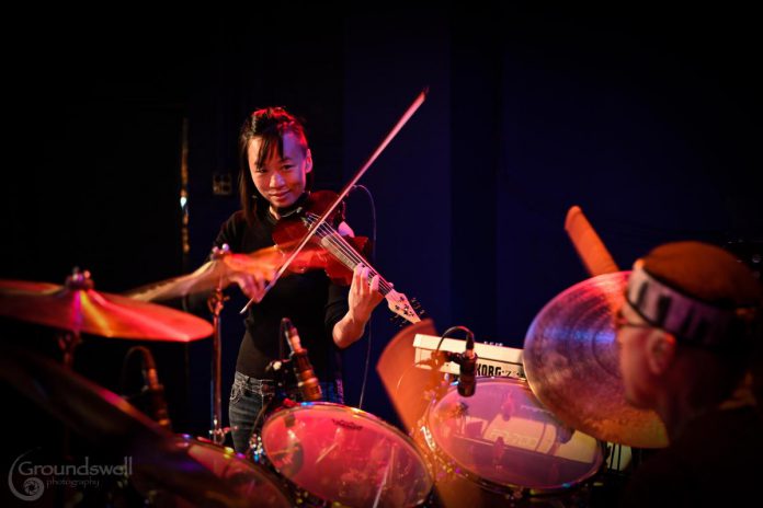 Violinist Victoria Yeh performing with Paul DeLong's ONE WORD jazz fusion band at the Gordon Best Theatre in downtown Peterborough on May 4, 2023. As part of her six-concert music series "Travel by Sound", ONE WORD performed at Peterborough's Market Hall on October 26, 2023. (Photo: Trevor Hesselink / Groundswell Photography)