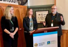 Canadian Mental Health Association Haliburton, Kawartha, Pine Ridge (CMHA HKPR) CEO Mark Graham (right) speaks about the new 988 suicide crisis helpline at a media event on November 17, 2023 with program and services director Tracy Graham (left) and corporate services director Ellen Watkins. According to the association, the number of people dialing the helpline locally since its launch on November 30, 2023 is on the rise. (Photo: CMHA HKPR)