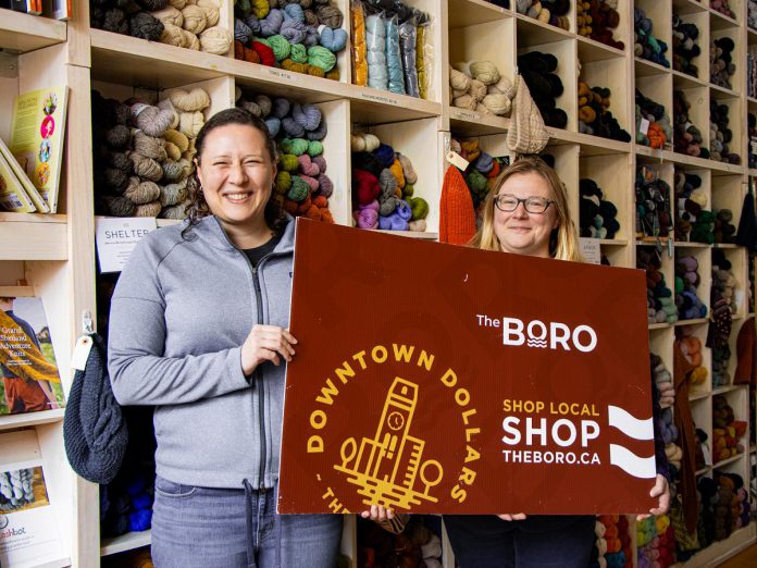 Amanda Kennedy (left) with Deanna Guttman (right), owner of Needles in the Hay at 385 Water Street in downtown Peterborough, where Kennedy completed the grand prize winning passport in the Peterborough Downtown Business Improvement Area (DBIA) annual Holiday Shopping Passport program. Kennedy won $1,500 in Boro gift cards, redeemable at participating downtown businesses. (Photo: Peterborough DBIA)