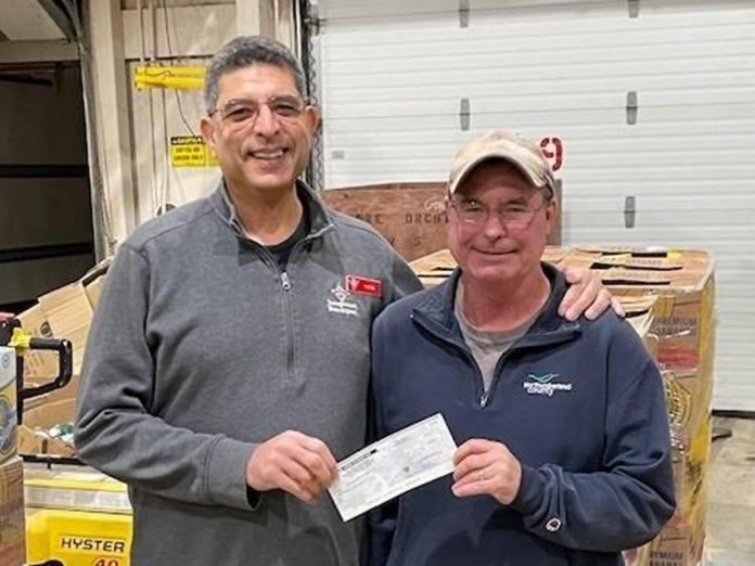 Canadian Tire Cobourg associate dealer Peter Puglia (left) stands with Northumberland County building superintendent Jim Davis in support of Northumberland County's Food 4 All Warehouse. (Photo: Northumberland County)