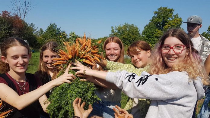 The 2022 cohort of Youth Leadership in Sustainability (YLS) attends a workshop at the Trent Vegetable Gardens to learn about sustainable farming practices. (Photo: Cameron Douglas / YLS)