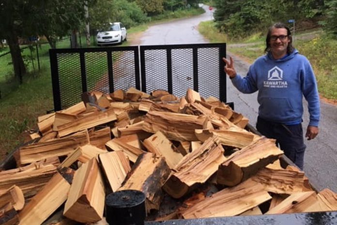 Volunteer Jamie Barrieau delivering firewood as part of Heat Bank Haliburton County, a program of the Central Food Network. (Photo: Kawartha Home and Hearth)