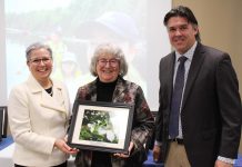 Cathy Dueck (middle) accepts the 2024 Individual Conservationist Award from Otonabee Conservation CAO Janette Loveys Smith and the organization's new board chair Michael Metcalf at Otonabee Conservation's annual general meeting on January 18, 2024 at the Riverview Park and Zoo Rotary Education Centre. A lifelong naturalist, Dueck has contributed to the naturalization of many parks and greenspaces, including founding what would become Peterborough GreenUP's Ecology Park. Most recently, as the coordinator of the Pathway to Stewardship Project, Dueck worked to develop resources and opportunities to help families, students, and community members get outside and enjoy nature. (Photo courtesy of Otonabee Conservation)