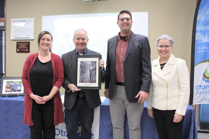 Jess Conlin (left) and Shawn Morey (second from right) of the Peterborough Humane Society accept the 2024 Environmental Stewardship Award from from Otonabee Conservation's new board chair Kevin Duguay (holding the award) and CAO Janette Loveys Smith at Otonabee Conservation's annual general meeting on January 18, 2024 at the Riverview Park and Zoo Rotary Education Centre. The Peterborough Humane Society worked with Otonabee Conservation while constructing the new animal care centre, where 868 native native trees and shrubs have been planted over the past three years. (Photo courtesy of Otonabee Conservation)