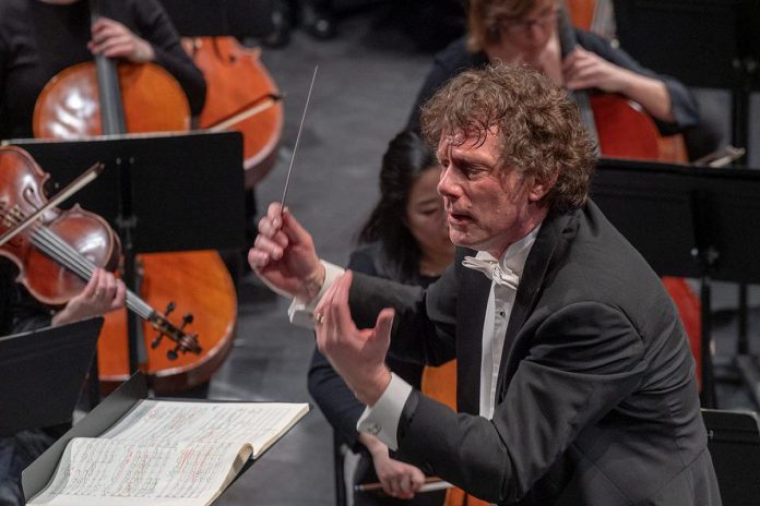 Peterborough Symphony Orchestra music director and conductor Michael Newnham in 2019. During "Popcorn, Please!" at Showplace Performance Centre on February 3, 2024, Maestro Newnham will lead the orchestra as they perform music from popular films including Star Wars, E.T., Mission: Impossible, the James Bond and Lord of the Rings franchises, and more. (Photo: Huw Morgan)