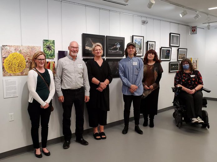 SPARK Photo Festival's 2023 Emerging Artists at their Light the SPARK: Emerging Artists Exhibit at the Peterborough Public Library, from left to right: Elayne Linn, Keith Manser, Lezley Woodhams, Jonathon McKinney, Shirlanne Pawley-Boyd, and Sioux Dickson. (Photo courtesy of SPARK Photo Festival)