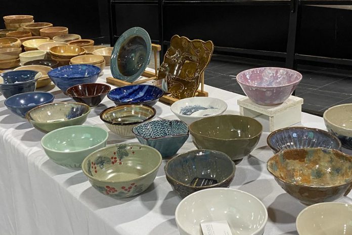 Some of the unique hand-crafted ceramic and wooden bowls donated by local artisans of the Kawartha Potters Guild and Kawartha Woodturners Guild for the 2022 Empty Bowls fundraiser at The Venue in downtown Peterborough. YWCA Peterborough Haliburton's annual fundraiser to alleviate food insecurity returns for its 20th year on February 23, 2024 at The Venue  with an in-person seated lunch for the first time since the pandemic began. (Photo: Kawartha Potters Guild / Facebook)