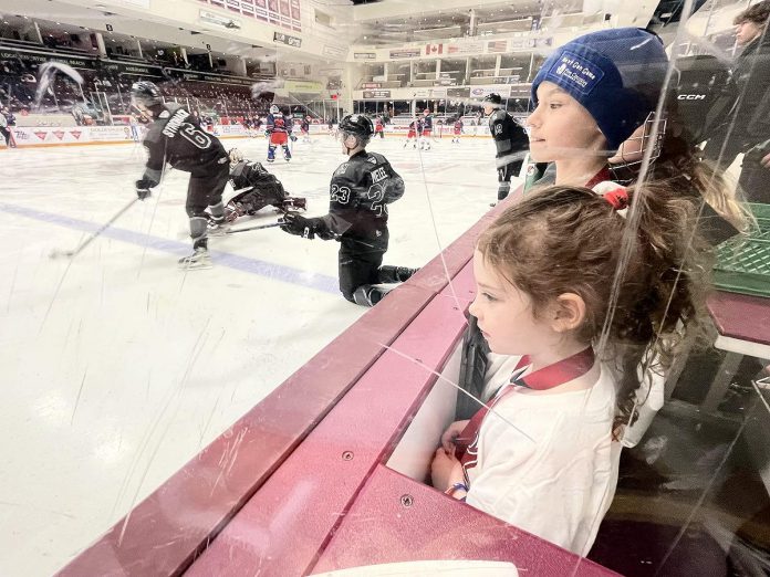 Clients of Five Counties Children's Centre who took take part in the Next Gen Game with the Peterborough Petes got a rink-side seat for the pre-game warmup as the Petes readied to play the Kitchener Rangers on February 19, 2024. In total, more than $21,300 was raised at the game to support treatment service at Five Counties. (Photo courtesy of Five Counties Children's Centre)