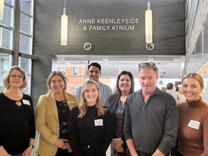 On February 5, 2024, Peterborough Regional Health Centre (PRHC) unveiled the Anne Keenleyside & Family Atrium, in honour of the late Trent University bioarcheology professor of bioarcheology who passed away in October 2022 and left a $2 million legacy gift to the hospital foundation. Pictured (left to right) are Keenleyside's close friend Lynda Wood, PRHC president and CEO Dr. Lynn Mikula, Keenleyside's stepdaughter Cassandra Butler, PRHC Radiologist Dr. Peter Gianakopoulos (in the back), PRHC Foundation president and CEO Lesley Heighway, Keenleyside's partner Pat Butler, and Keenleyside's stepdaughter Melissa Butler. (Photo courtesy of PRHC Foundation)