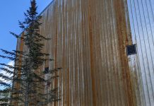 The new Canadian Canoe Museum under construction at 2077 Ashburnham Drive in Peterborough is clad in Corten steel siding. Also known as weathering steel, the siding is designed to rust with exposure to weather and will eventually form a stable surface with a rust-like patina finish. This finish guards against future corrosion and prevents the need to paint the steel in the future. (Photo: Bruce Head / kawarthaNOW)