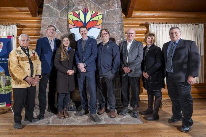 Attendees at Kawartha Land Trust's announcement on February 12, 2024 at Sandy Point on the new Hammer Family Nature Preserve included (from left to right) Curve Lake First Nation Chief Keith Knott, Peterborough-Kawartha MPP Dave Smith, Ontario Minister of Environment, Conservation, and Parks Andrea Khanjin, senior advisor to the Ontario Conservation Community - The Schad Foundation Mike Hendren, Kawartha Land Trust executive director John Kintare and board chair Paul Downs, Haliburton-Kawartha Lakes-Brock MPP Laurie Scott, and Municipality of Trent Lakes Mayor Terry Lambshead. (Photo: Stephanie Lake for Kawartha Land Trust)