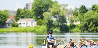 A dragon boat team races at Peterborough's Dragon Boat Festival in 2015. Since 2001, the annual festival has raised more than $4.2 million for breast cancer care at Peterborough Regional Health Centre. (Photo: Linda McIlwain / kawarthaNOW)