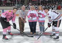 The puck drop for the Peterborough Petes' 15th annual Pink in the Rink game at the Peterborough Memorial Centre on February 3, 2024. Despite losing in overtime to the Niagara IceDogs, the Petes organization achieved its goal of breaking $1 million in funds raised for cancer care over the past 15 years of the annual game. (Photo: Kenneth Andersen Photography)