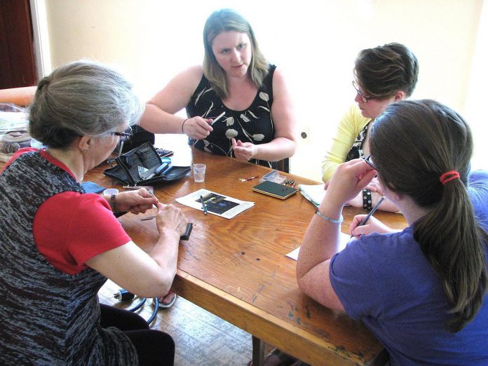 Oboist Christie Goodwin leading a reed-making workshop. She has been teaching music to students of all ages since she was 16 years old. (Photo courtesy of Christie Goodwin)