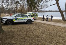 Paramedics at Roger's Cove in Peteborough's East City on February 27, 2024 after responding to a report of a woman who fell into the water after walking along the ice on the shoreline. (Photo: Bruce Head / kawarthaNOW)