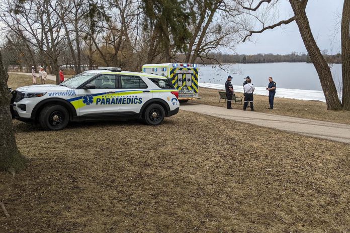 Paramedics at Roger's Cove in Peteborough's East City on February 27, 2024 after responding to a report of a woman who fell into the water after walking along the ice on the shoreline. (Photo: Bruce Head / kawarthaNOW)