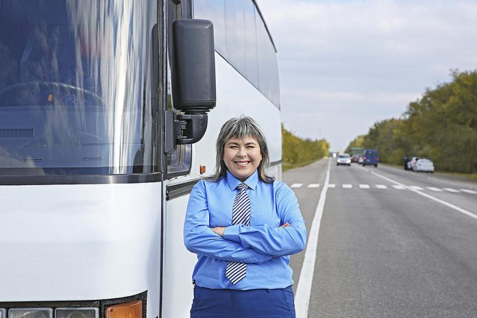 A bus driver whose ultimate career goal is to own and operate her own bus company can use the Workforce Development Board's interactive online Transportation Career Ladder to find out what it will take to get there. (Stock photo)