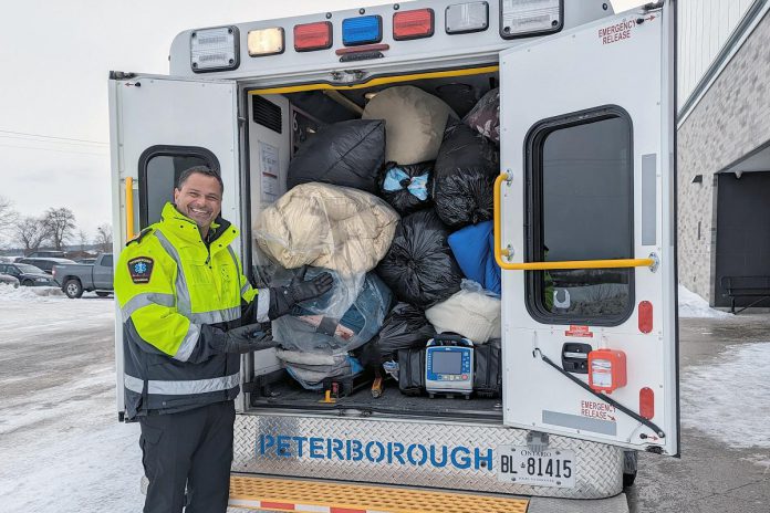 Peterborough Paramedics deputy chief Craig Jones with some of the 1,500 donations of blankets and sleeping bags donated by members of the community for the annual "Blankets for People" initiative. At pop-up locations throughout Peterborough County, residents were encouraged to fill an ambulance with blanket donations. Windsor's Drycleaning Centre ensured all the donations were cleaned prior to distribution for people in need, including those using the Trinity Community Centre in downtown Peterborough. (Photo: Peterborough County)