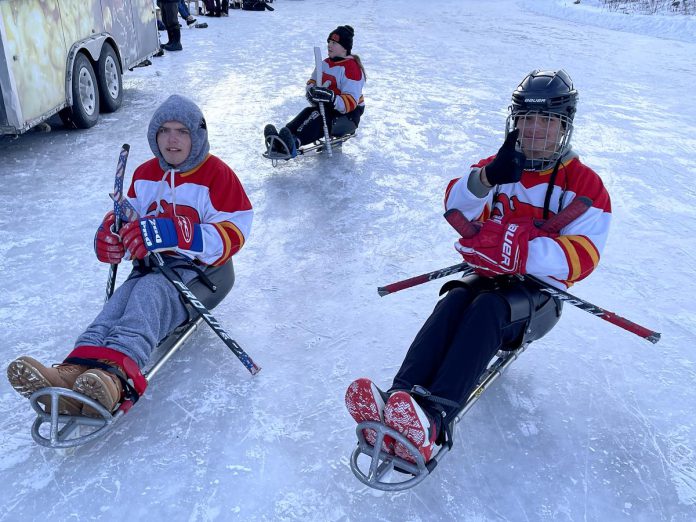 Members of the Kawartha Blazers Sledge Hockey Club were among the more than 300 skaters who took to the ice at the Ontario Speed Skating Oval in Lakefield on February 17, 2024 for the first-ever Candlelights for Kids fundraising event. In total, more than $1,800 was raised for Five Counties Children's Centre and the skating oval. (Photo: Five Counties)