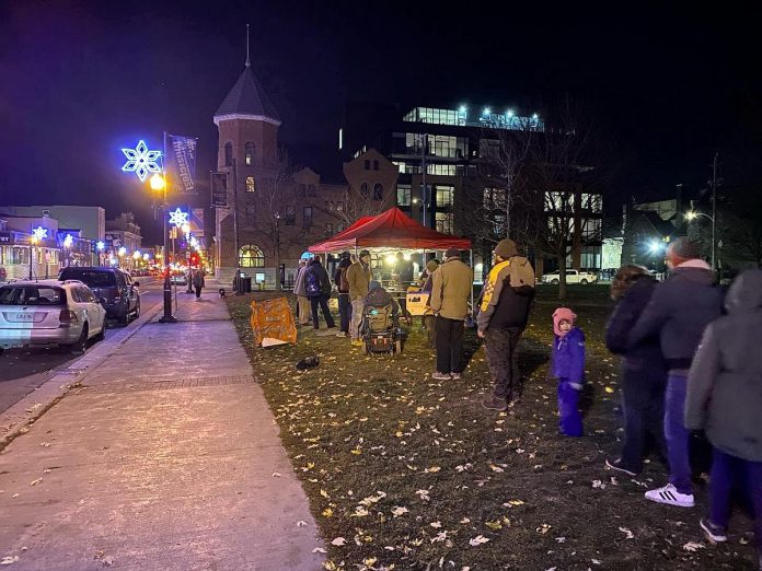 Food Not Bombs Peterborough serving a free meal at Confederation Square across from City Hall on November 14, 2022. The group, which has been serving free meals at the park or outside City Hall since November 2005, was told on March 4, 2024 by a security guard contracted by the City of Peterborough that it now required a permit to continue to do so. (Photo: Myles Connor / Facebook)