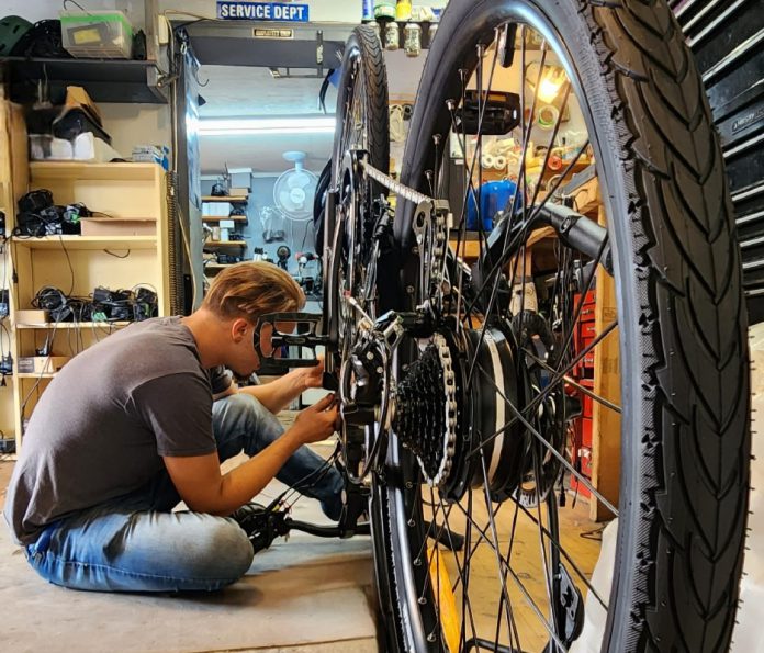 Preparing your e-bike for the cycling season includes inspecting the battery and charger, tires and wheels, brakes, and drive system. For a more comprehensive spring tune-up, you can visit a professional e-bike mechanic. (Photo courtesy of Green Street)