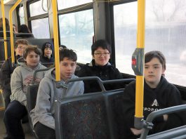 Students on a Peterborough Transit bus as part of a Grade 8 Transit Quest orientation in advance of March Break. The Grade 8 students learned how to use a transfer pass and safely sit on the bus, and increased their awareness about the different tools to navigate the system. (Photo: Jessica Todd / GreenUP)