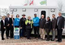 Northumberland Paramedics Chief Susan Brown (sixth from left) passes the keys of a decommissioned ambulance to Habitat for Humanity Northumberland construction manager Tobias Moeller on March 20, 2024. Also pictured from left to right are Northumberland County councillors Mandy Martin and Lucas Cleveland, deputy warden Olena Hankivsky, Habitat for Humanity Northumberland community and fund development co-ordinator Melissa Morrison, councillor Bob Crate, Habitat for Humanity Northumberland housing partnerships co-ordinator Aleecia Lugossy, warden Brian Ostrander, and councillor John Logel. (Photo: Northumberland county)