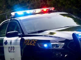 An Ontario Provincial Police (OPP) police car with lights flashing. (Photo: OPP)