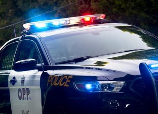 An Ontario Provincial Police (OPP) police car with lights flashing. (Photo: OPP)
