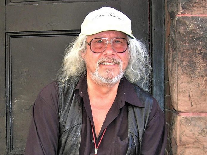 One of the photos that will be on display at Trevor Hosier's 'Photographs and Memories of Rock and Roll Legends' exhibit is of American folk singer-songwriter Arlo Guthrie, son of Woody Guthrie, one of he most significant figures in American folk music. Arlo is best known for his 1967 song "Alice's Restaurant." a satirical protest against the Vietnam War draft. (Photo courtesy of Trevor Hosier)