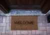A welcome mat outside the door of a house. (Stock photo)