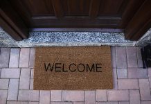 A welcome mat outside the door of a house. (Stock photo)