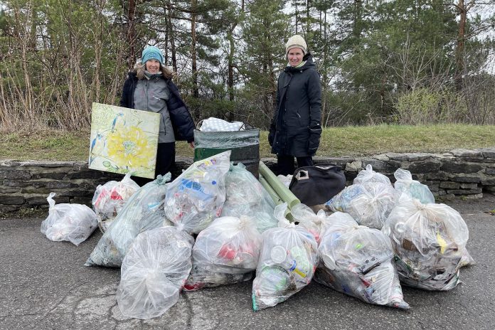 Nancy Cockburn and Jenn McCallum, co-founders of the Ashburnham Memorial Stewardship Group, pictured with garbage collected on Armour Hill in Peterborough on April 13, 2024. (Photo: John Hauser)