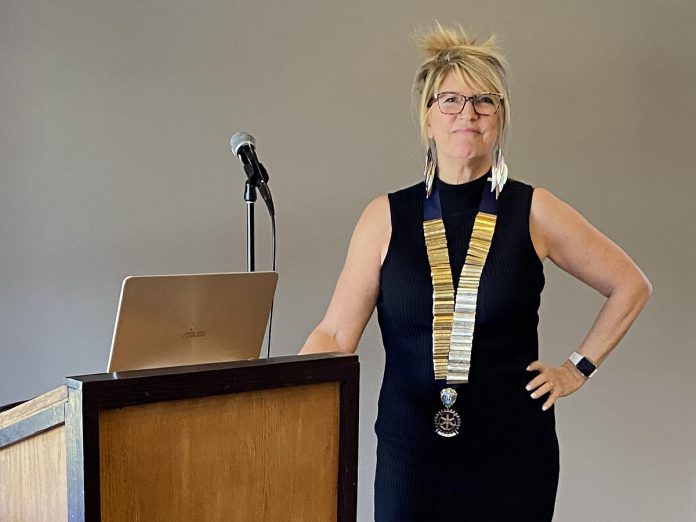 Betty Halman-Plumley at a recent Rotary Club of Peterborough meeting wearing a necklace with the names of all the club presidents since 1921. Though she is only the fifth woman on the list, she is not weighed down by the pressure of such a significant role but rather is guided and excited by it, feeling like she was always meant to be a leader. (Photo courtesy of Betty Halman-Plumley)