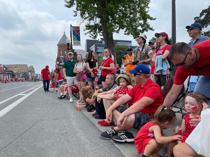 A crowd along George Street in downtown Peterborough during the 2023 Canada Day parade. (Photo: City of Peterborough / Facebook)