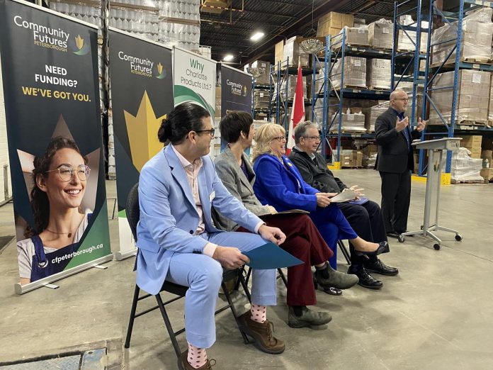 Charlotte Products CEO Matt Strano speaks during the announcement of Community Futures Peterborough's new Climate Change and Environment Fund at an event at Charlotte Products' Fisher Drive location on Earth Day (April 22, 2024). Seated, from left to right, are Peterborough & the Kawarthas Economic Development director of business attraction, retention and expansion Jamey Coughlin, Peterborough GreenUP executive director Tegan Moss, Peterborough County Warden Bonnie Clark, and Peterborough Mayor Jeff Leal. (Photo: Paul Rellinger / kawarthaNOW)