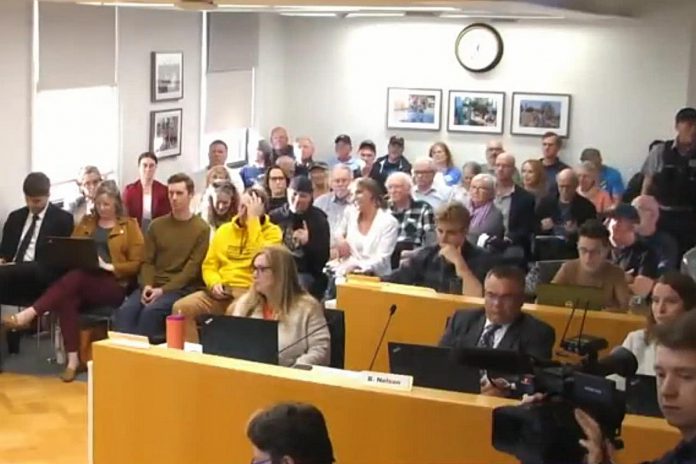 Registered delegations and other members of the public in the gallery during the Peterborough city council meeting on April 8, 2024. Councillors heard from 10 delegations both in favour and against delaying approval of the Bonnerworth Park redevelopment. (kawarthaNOW screenshot of City of Peterborough video)