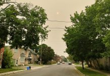 Climate change is associated with a variety of health hazards, including extreme temperatures and reduced air quality. Pictured is wildfire smoke in Peterborough during summer 2023. Some people are more vulnerable than others to the health impacts of climate change. (Photo: Tegan Moss / GreenUP)