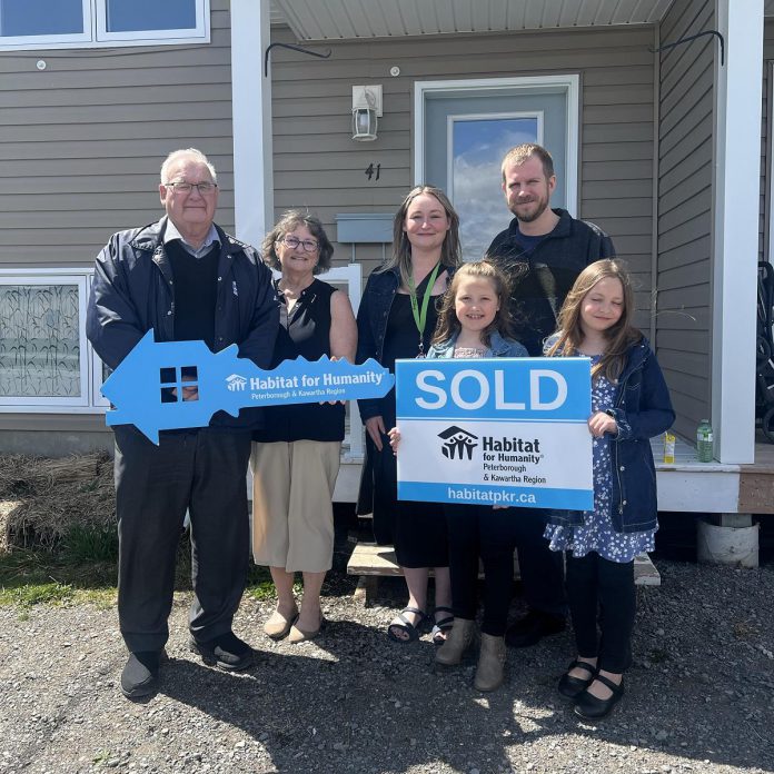 Kawartha Lakes Mayor Doug Elmslie and Humanity Peterborough & Kawartha Region CEO Susan Zambonin with Brittany, Jason, and their two children at a housewarming celebration on April 21, 2024 at the family's new home in Lindsay. (Photo courtesy of Habitat PKR)