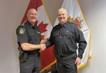 Retiring Kawartha Lakes Police Service chief Mark Mitchell (left) congratulates Inspector Kirk Robertson, who will become the new police chief effective May 18, 2024. (Photo: Kawartha Lakes Police Service)