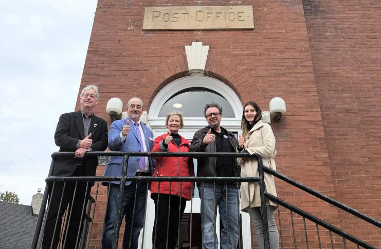 Selwyn Township Mayor Sherry Senis (middle) flanked by councillors John Boyko and Ron Black (left) and Brian Henry and Mary Coulas (right) during the official reopening of Lakefield's former post office at 12 Queen Street on April 27, 2024 following a $1.6-million retrofit project funded by the township and the federal government. (Photo courtesy of Selwyn Township)