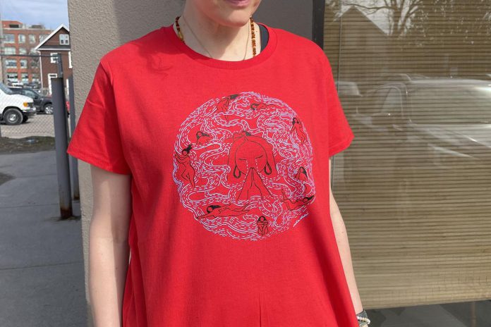 Niijkiwendidaa Anishnaabekwewag Services Circle in honour of National Day of Awareness for Missing and Murdered Indigenous Women, Girls, and 2-Spirit People, also known as Red Dress Day. Nish Tees owner James Hodgson is selling red T-shirts with a design by Métis-Japanese Canadian artist Mia Ohki. (Photo courtesy of Nish Tees)