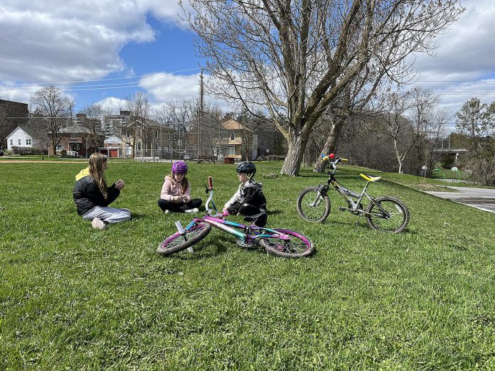 The redevelopment plan for Bonnerworth Park in Peterborough approved by city council on April 8, 2024 would see much of the park's existing greenspace removed to accommodate 16 pickleball courts, an expanded skate park, a bike pump track, and an 80-vehicle parking lot. According to the Save Bonnerworth Park group, the greenspace is used year-round for kites, frisbee, snow forts, skiing, and dog walking. (Photo: Save Bonnerworth Park website)