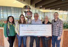 Toronto resident Bill B. (middle) with a $646,749 cheque representing the grand prize in the Split the Pot Lottery, a joint venture of 51 hospital foundations across Ontario including the Ross Memorial Hospital Foundation in Lindsay. Also pictured from left to right are foundation CEO Erin Coons, Bill's daughter Laura, Bill's wife Debbie, and Bill's son-in-law Adam. (Photo courtesy of Ross Memorial Hospital Foundation)