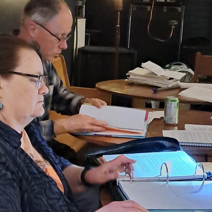 Stage manager Marilyn Robinson and director Gerry McBride consult the script during early rehearsals for "Tide of Hope", Trent Valley Archives Theatre's inaugural history play being staged at Market Hall Performing Arts Centre on May 15 and 16, 2024. (Photo courtesy of Trent Valley Archives Theatre) 